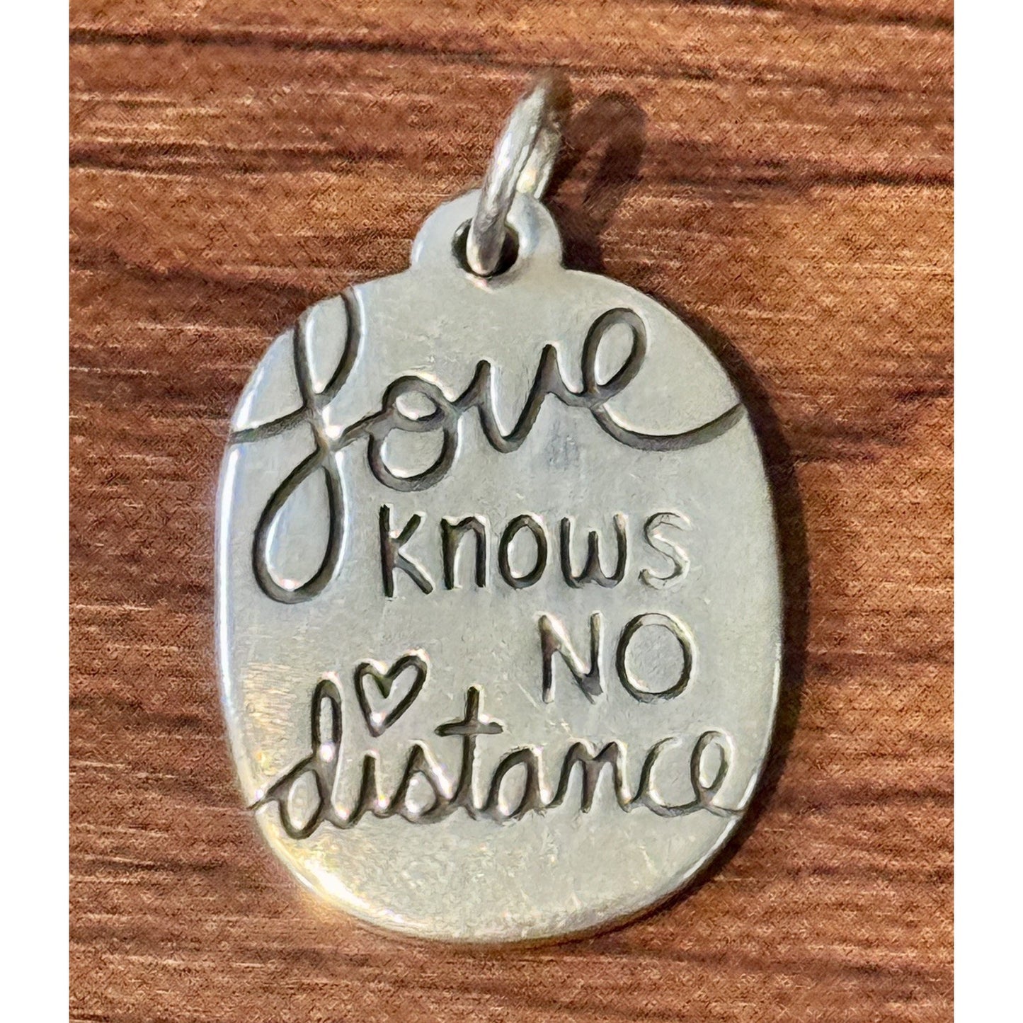 James Avery Retired Love knows no distance Sterling Silver