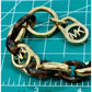 Michael Kors Tortoise Shell And Yellow Gold Tone MK Oval Link Charm Bracelet 8”