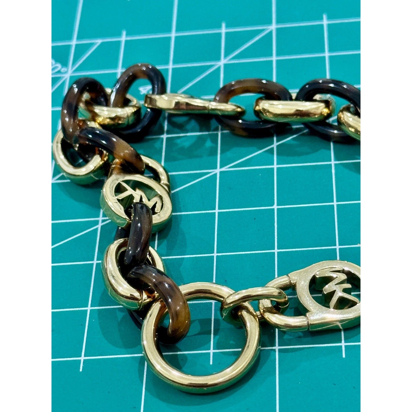 Michael Kors Tortoise Shell And Yellow Gold Tone MK Oval Link Charm Bracelet 8”