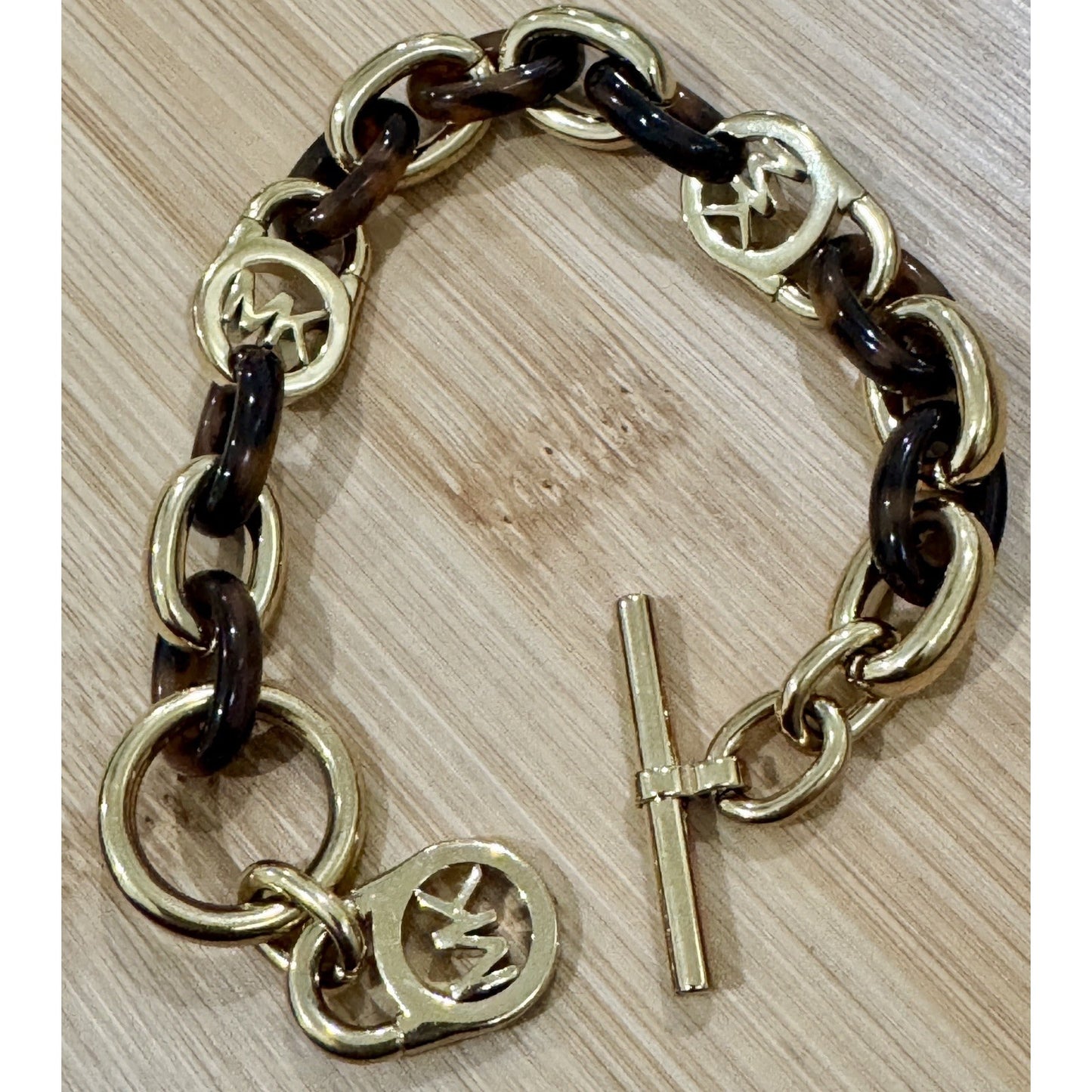 Michael Kors Tortoise Shell And Yellow Gold Tone MK Oval Link Charm Bracelet 8”