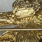 Preowned Vintage New in Box Signed Christian Dior Gold Tone Textured Rope Knot Brooch Pin