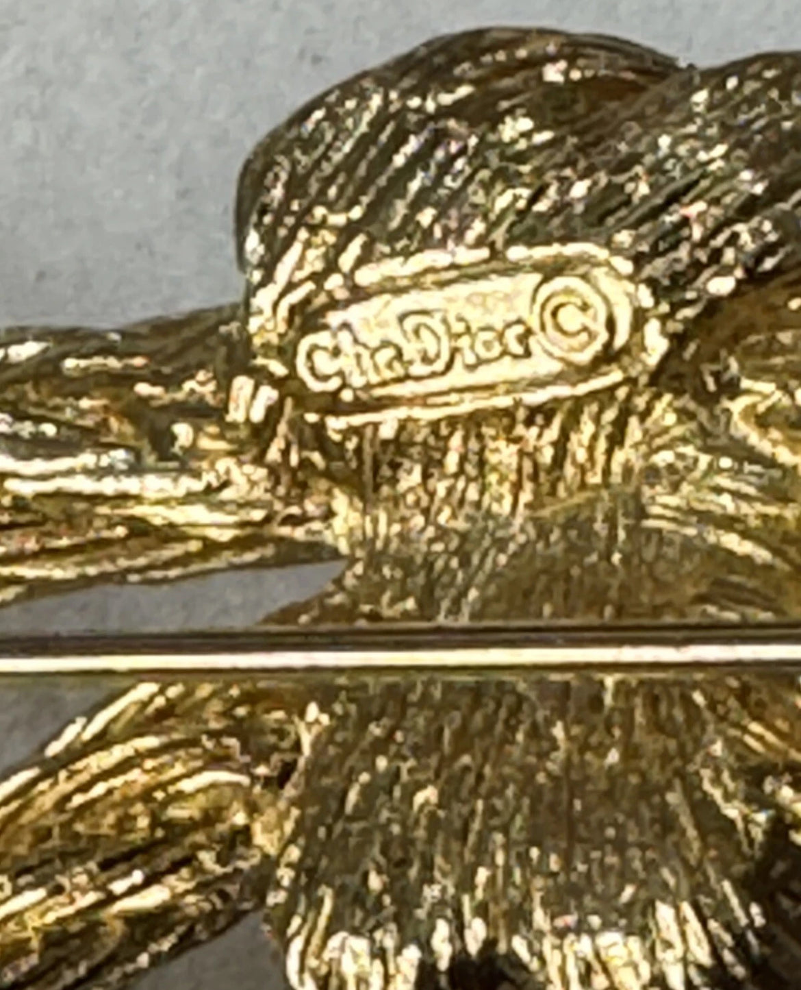 Preowned Vintage New in Box Signed Christian Dior Gold Tone Textured Rope Knot Brooch Pin