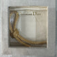 Preowned Vintage New in Box Signed Christian Dior Gold Tone Textured Rope Knot Brooch Pin