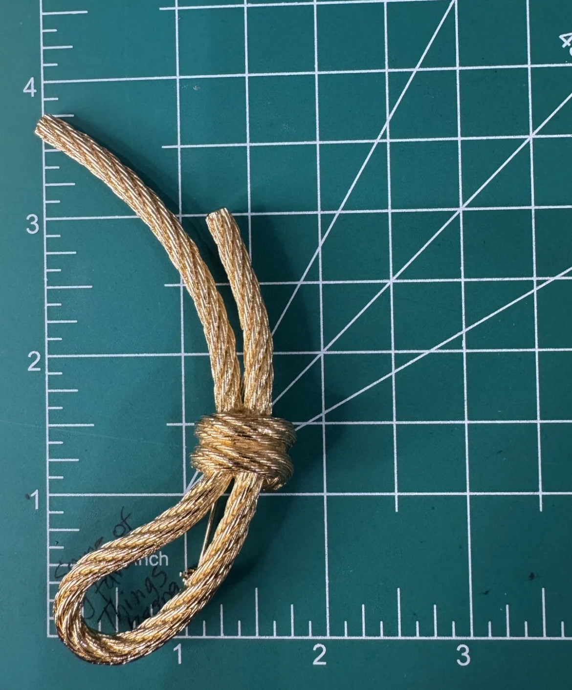 Preowned Vintage New in Box Signed Christian Dior Gold Tone Textured Rope Knot Brooch Pin