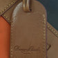 Preowned VINTAGE Dooney & Bourke Tote Bag Purse Saffiano Tassel Orange w/ Brown Trim
