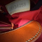 Preowned VINTAGE Dooney & Bourke Tote Bag Purse Saffiano Tassel Orange w/ Brown Trim