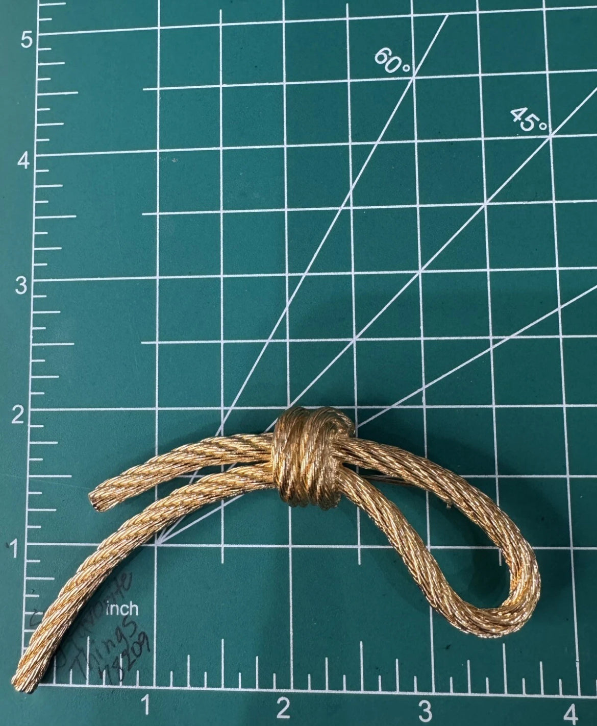 Preowned Vintage New in Box Signed Christian Dior Gold Tone Textured Rope Knot Brooch Pin